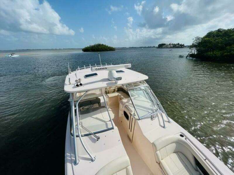 2014 Grady-White Freedom 335 boat on calm waters with scenic island background.