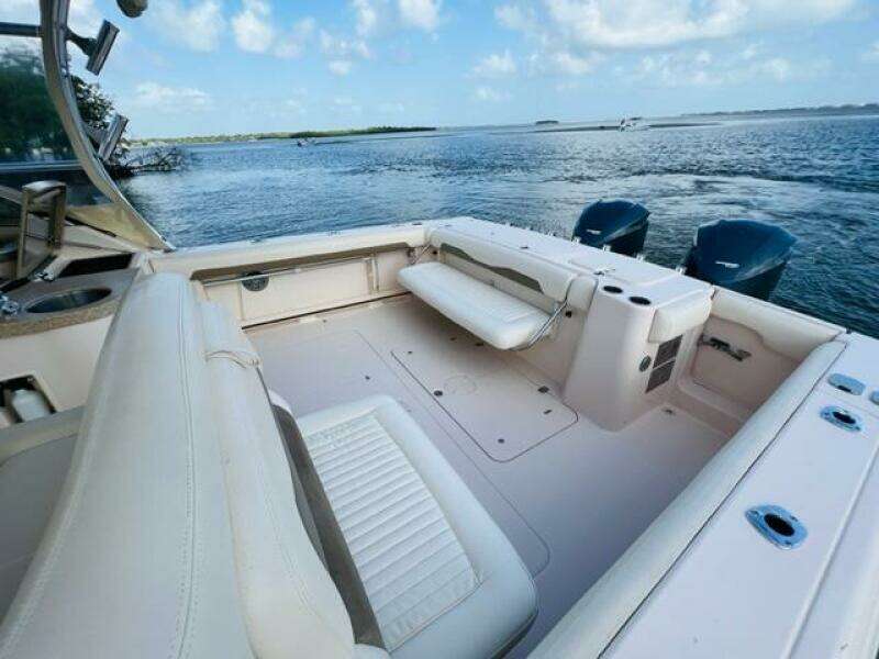 2014 Grady-White Freedom 335 boat interior with seating, ocean view, and twin outboard motors.