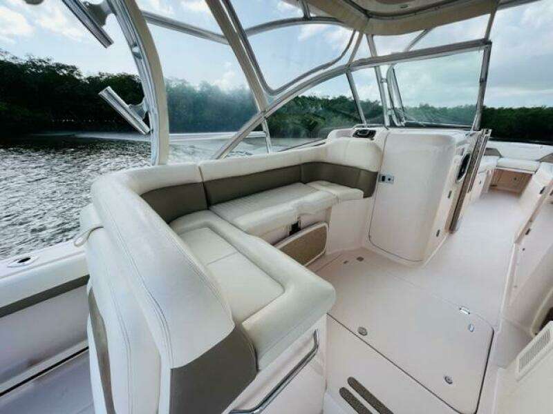 2014 Grady-White Freedom 335 boat interior with white seating and scenic water view.