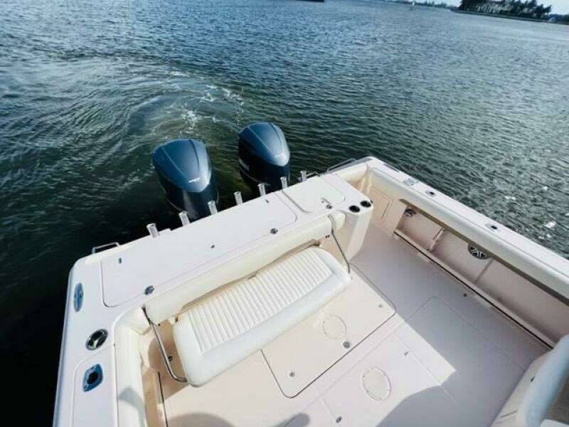 2014 Grady-White Freedom 335 boat with twin outboard motors on water.