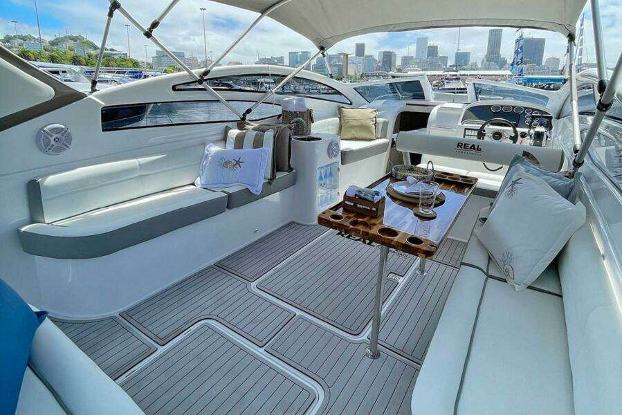 Luxurious 2023 Real 35 Special Deck (SD) yacht interior with city skyline view.