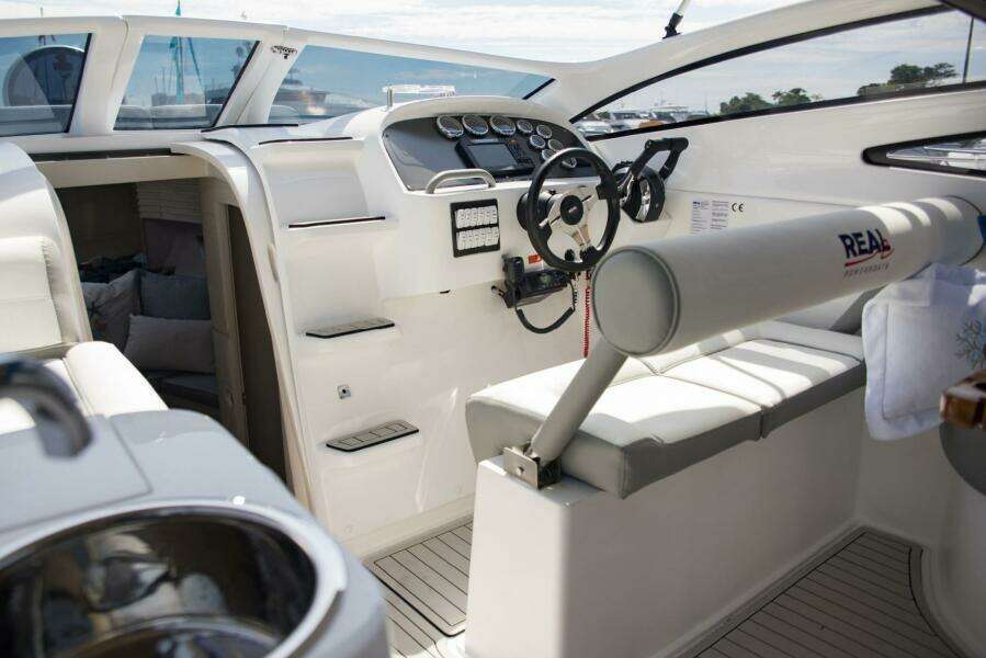 Interior of a 2023 Real 35 Special Deck (SD) boat with modern steering console.