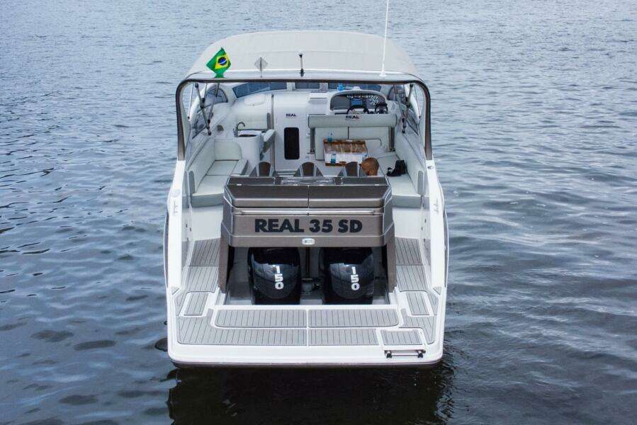 2023 Real 35 Special Deck (SD) boat on water, rear view.
