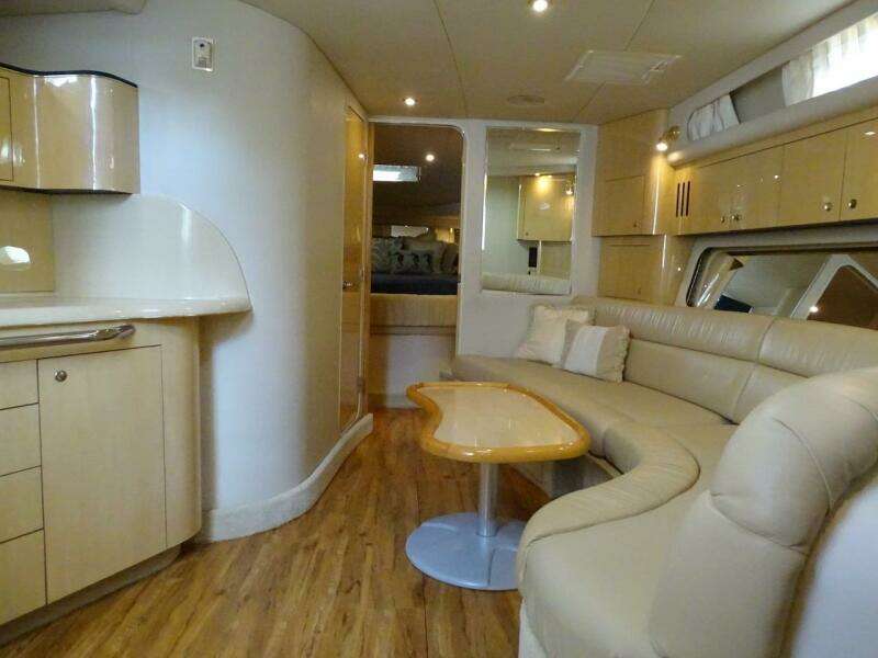 Interior of 2001 Sea Ray 410 Sundancer yacht with modern furnishings.