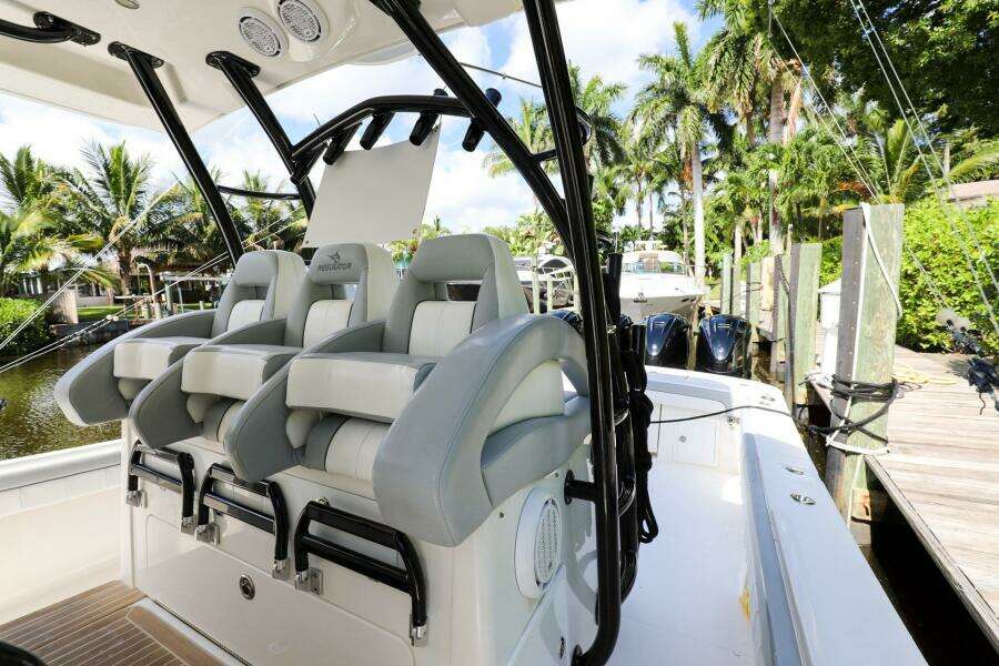 2020 Regulator 41 boat with luxurious seating and modern design at a dock.