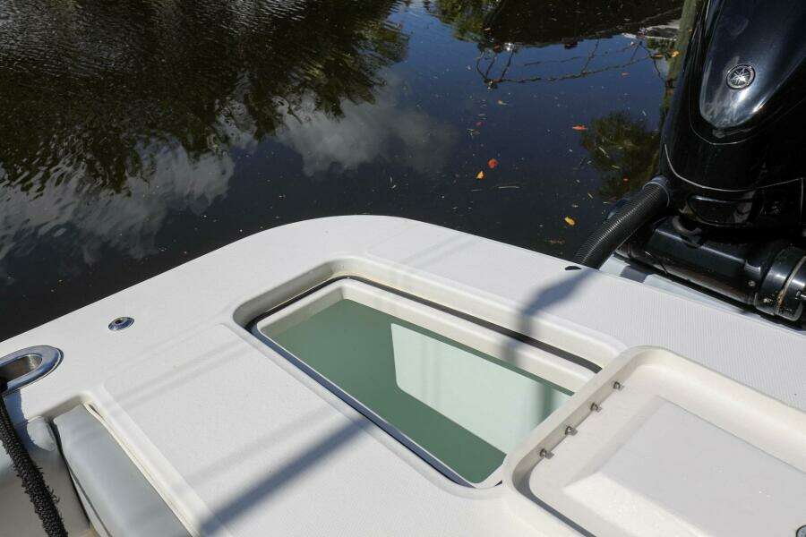 2020 Regulator 41 boat stern with water reflection and engine.
