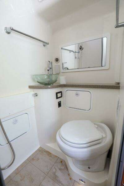 2020 Regulator 41 boat bathroom with modern fixtures and glass sink.