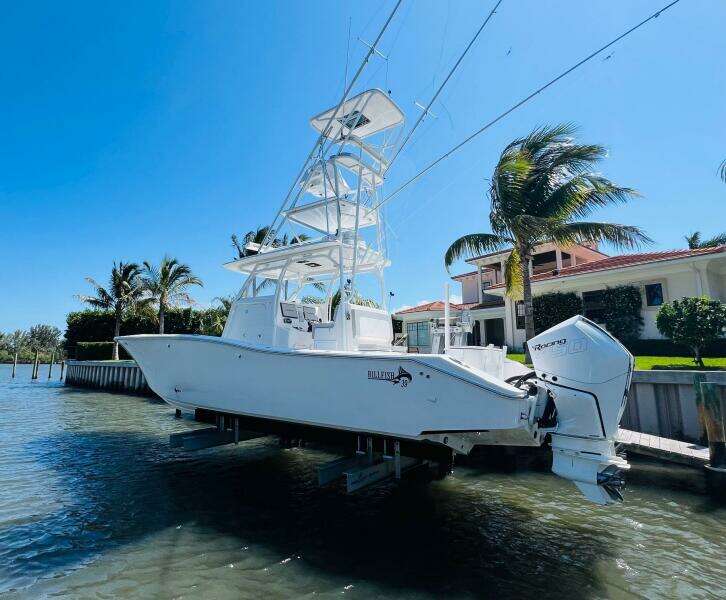 2015 Billfish 39 Custom CC boat docked near waterfront property.