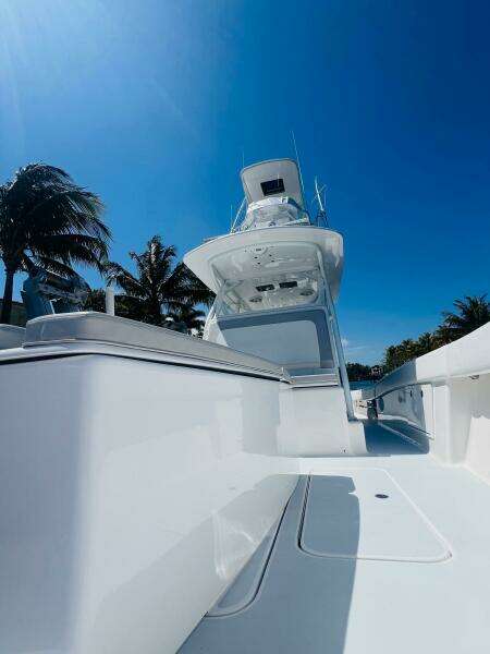 2015 Billfish 39 Custom CC boat with clear blue sky and palm trees.