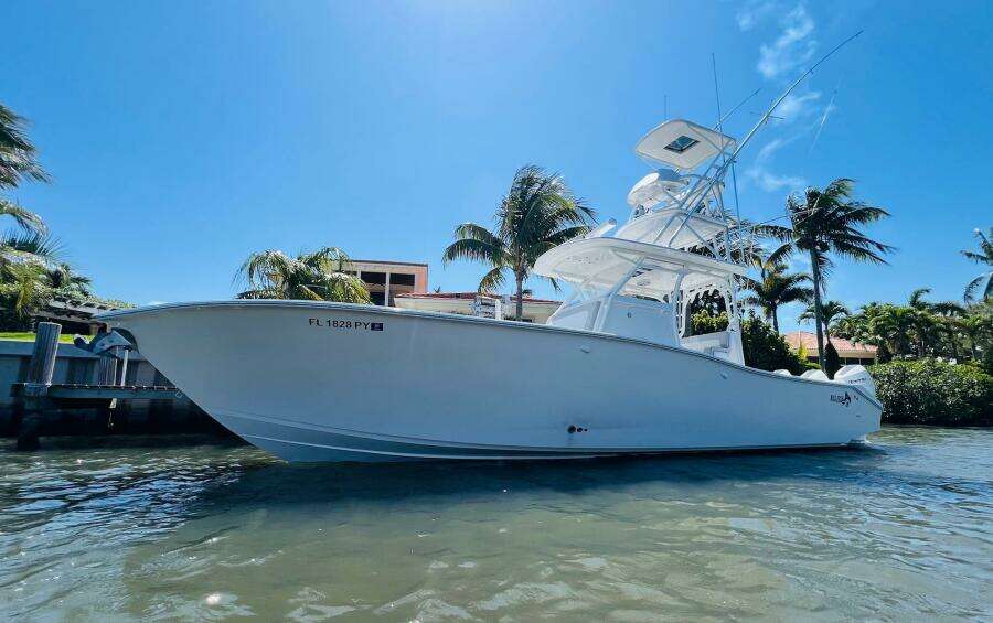 2015 Billfish 39 Custom CC boat docked in sunny waterfront location.