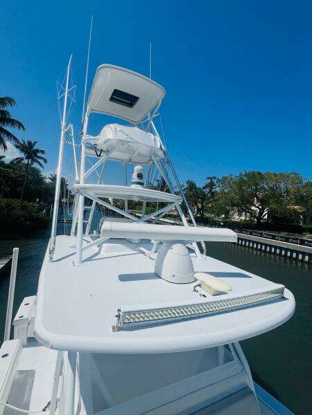 2015 Billfish 39 Custom CC boat with tower and clear blue sky.