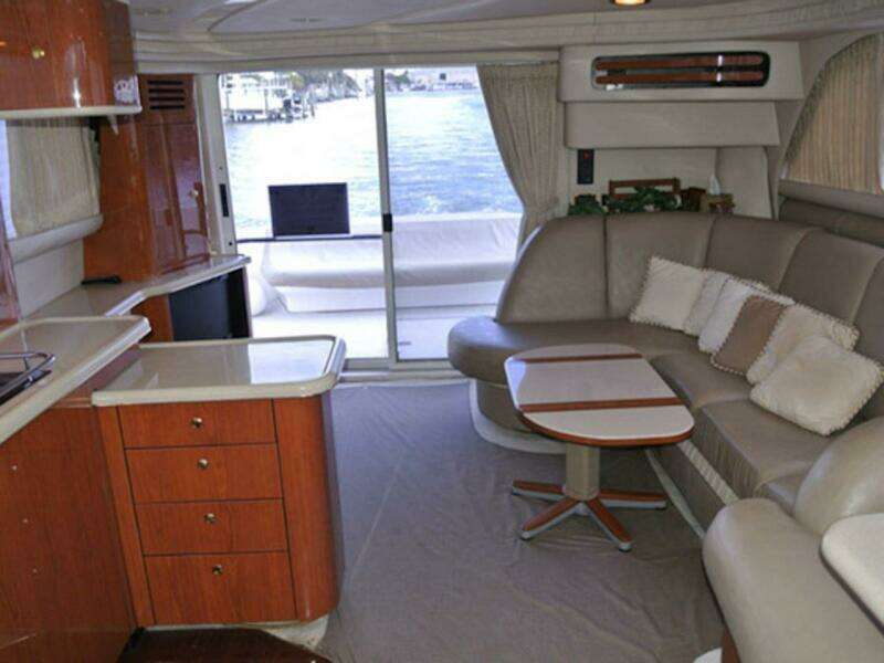 Interior of 1998 Sea Ray 480 Sedan Bridge yacht with modern furnishings and waterfront view.