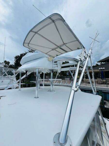 2003 Tiara Yachts 3800 Open with sleek canopy and polished metal supports.