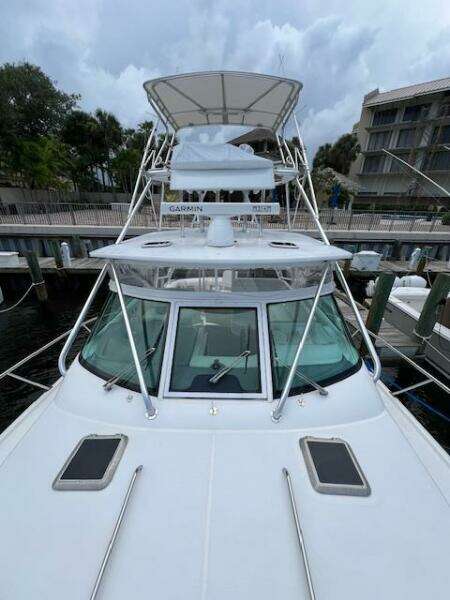 2003 Tiara Yachts 3800 Open docked, showcasing sleek design and spacious deck.