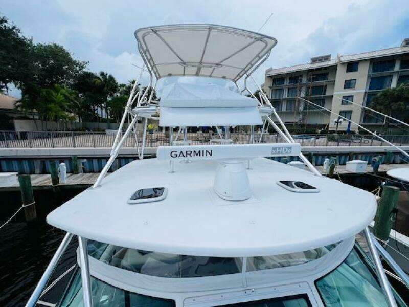 2003 Tiara Yachts 3800 Open with Garmin radar, docked at marina.