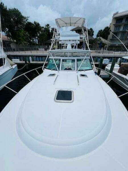 2003 Tiara Yachts 3800 Open docked, showcasing sleek design and spacious deck.