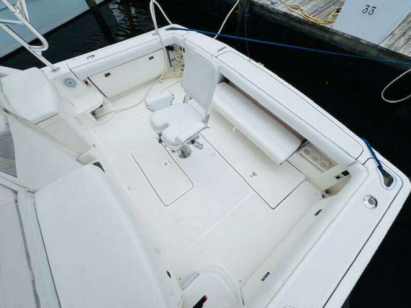 2003 Tiara Yachts 3800 Open boat deck with seating and storage.