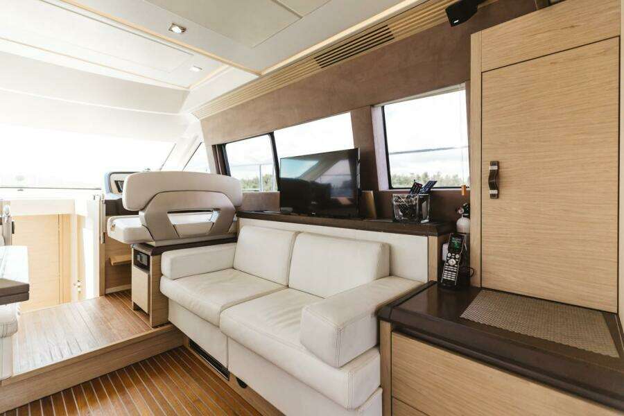 Luxurious interior of 2015 Beneteau Monte Carlo 5 yacht with modern furnishings.