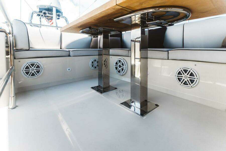 2015 Beneteau Monte Carlo 5 yacht interior with sleek seating and modern table design.