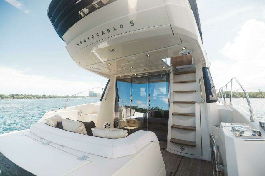 2015 Beneteau Monte Carlo 5 yacht with luxurious deck and seating area.