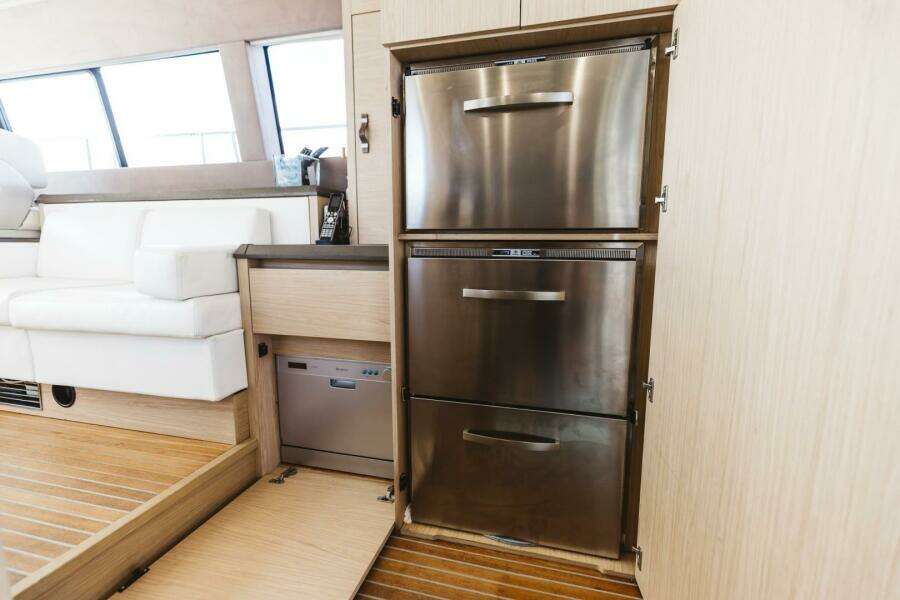 Luxury yacht interior with stainless steel appliances, Beneteau Monte Carlo 5, 2015 model.