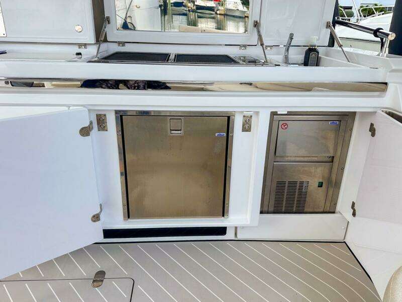 2023 Azimut Verve 47 yacht kitchen area with stainless steel appliances and sleek design.