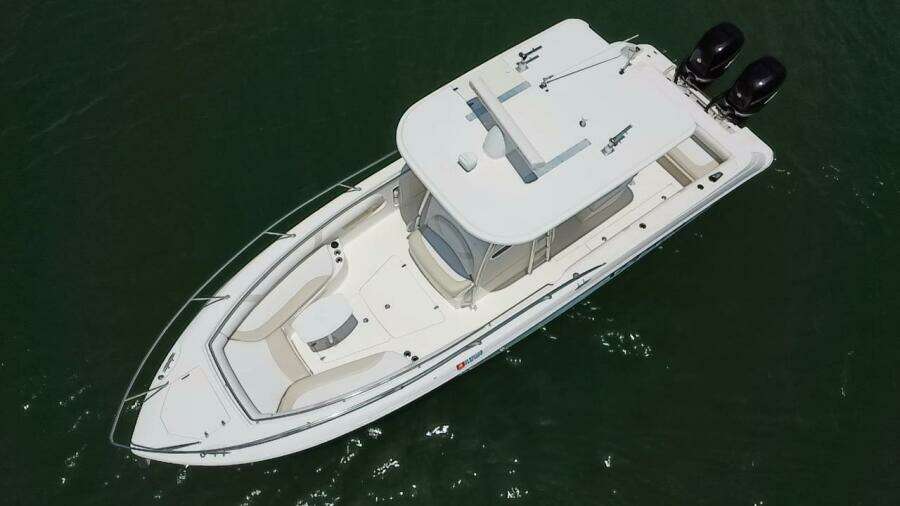 2008 Boston Whaler 320 Outrage boat with twin engines, aerial view.