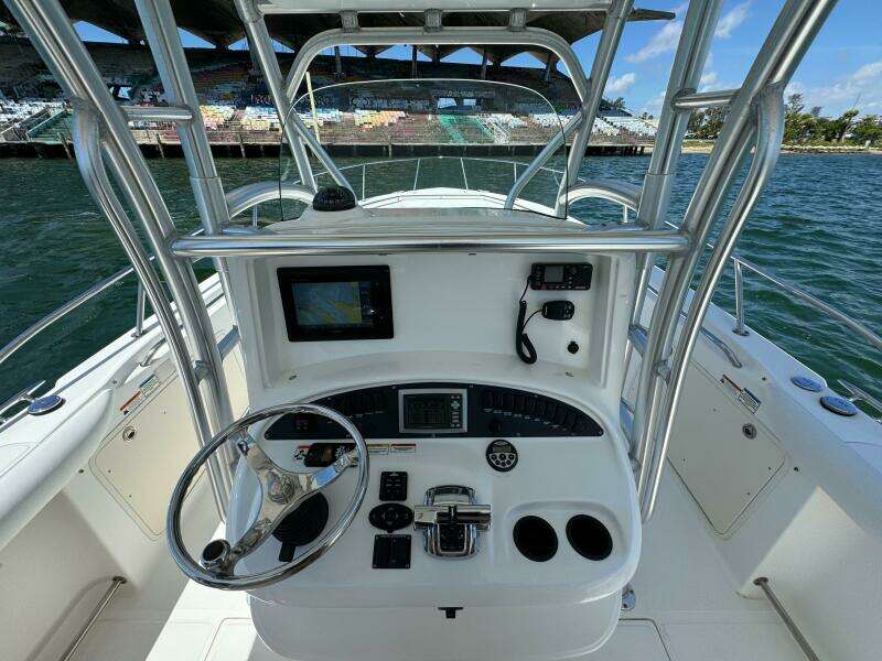 2008 Boston Whaler 320 Outrage boat helm with navigation equipment and controls.