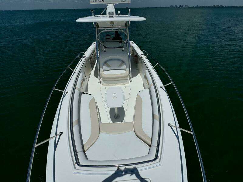 2008 Boston Whaler 320 Outrage boat on calm water, aerial view.