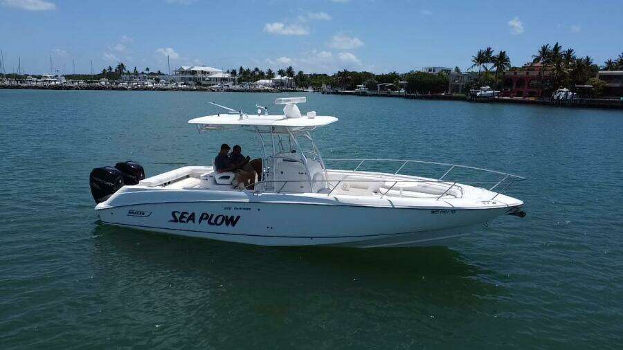 2008 Boston Whaler 320 Outrage boat named Sea Plow on the water.