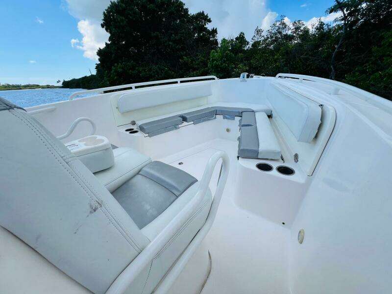 2012 Everglades 295 Center Console boat interior with seating and cup holders.