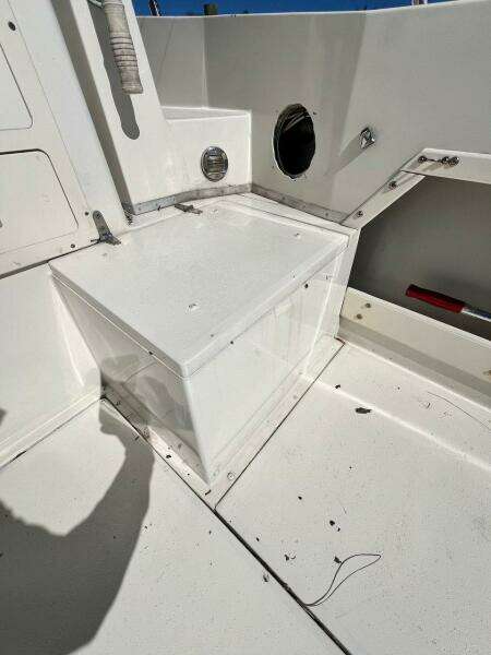 1988 Grady-White 25 SAILFISH boat interior, white seating area, clean and well-maintained.