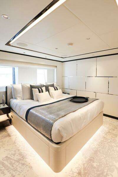 Luxurious bedroom interior in 2025 Majesty 120 yacht, featuring modern design and elegant decor.