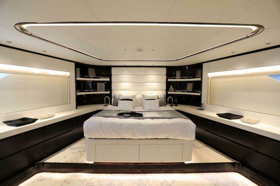 Luxurious bedroom interior on 2025 Majesty 120 yacht, featuring modern design and ambient lighting.