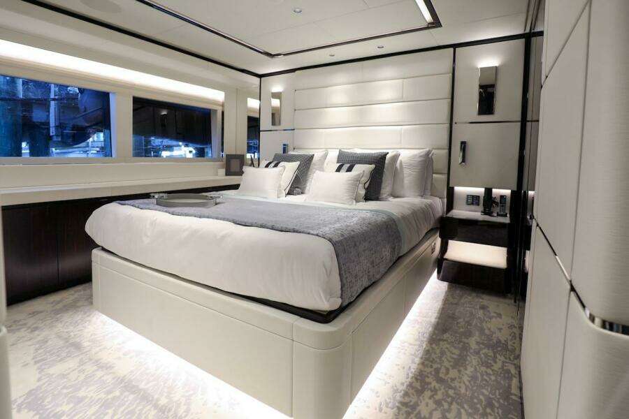 Luxurious bedroom interior of 2025 Majesty 120 yacht, featuring modern design and elegant furnishings.