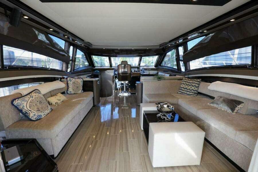 Luxurious interior of 2016 Marquis 660 Sport Yacht with elegant seating and modern decor.