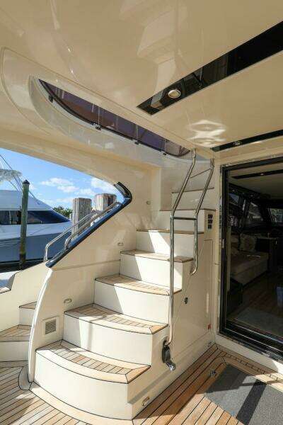 Staircase on 2016 Marquis 660 Sport Yacht with sleek interior and exterior design.