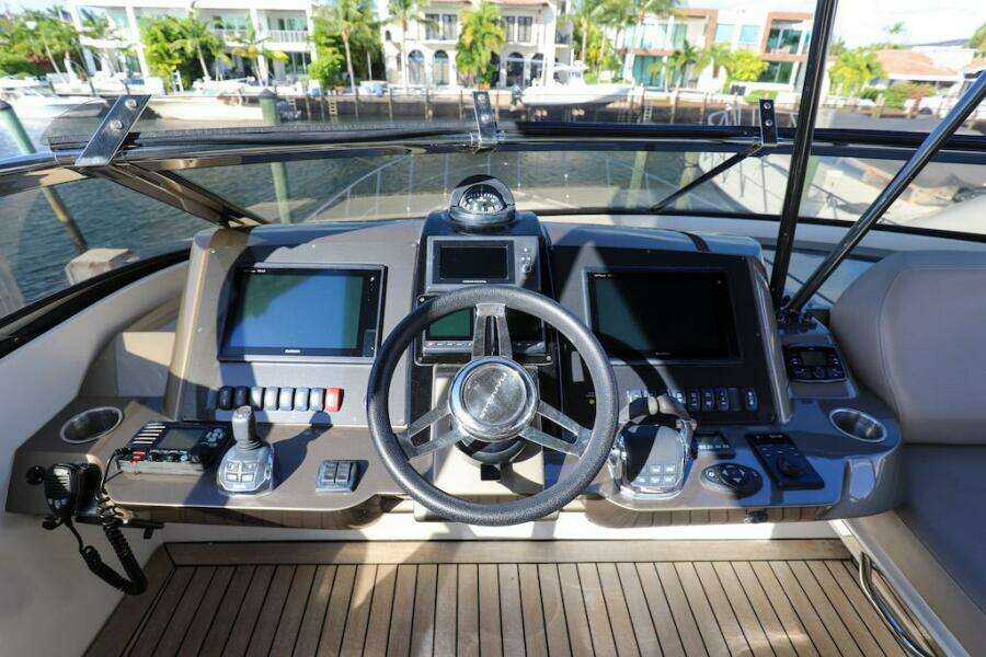 Cockpit of 2016 Marquis 660 Sport Yacht with advanced navigation controls and displays.
