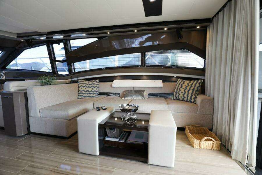 Luxurious interior of 2016 Marquis 660 Sport Yacht with modern seating and decor.