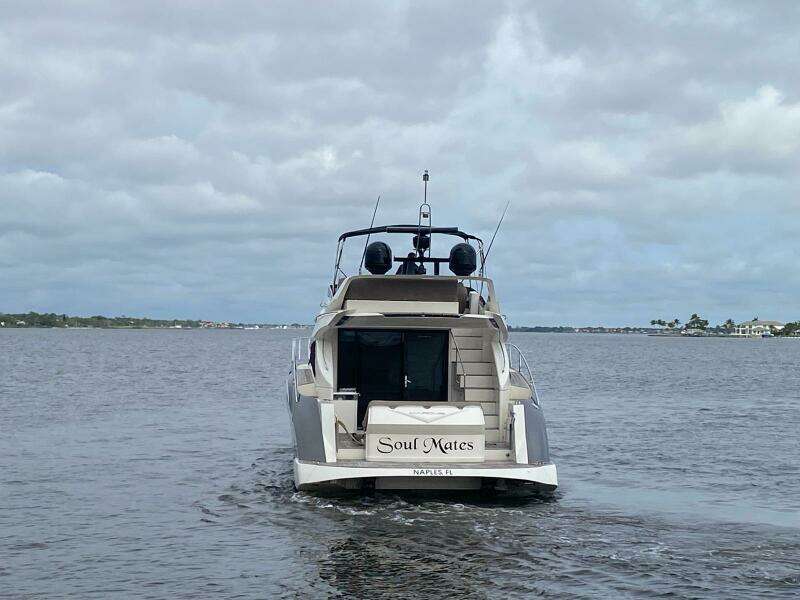 2017 Marquis 500 Sport Yacht Soul Mates cruising on a cloudy day.