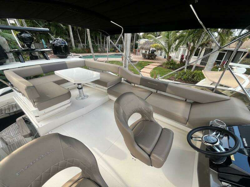 2017 Marquis 500 Sport Yacht interior with seating and steering area.