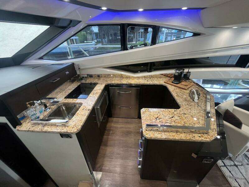 2017 Marquis 500 Sport Yacht kitchen with granite countertops and modern appliances.