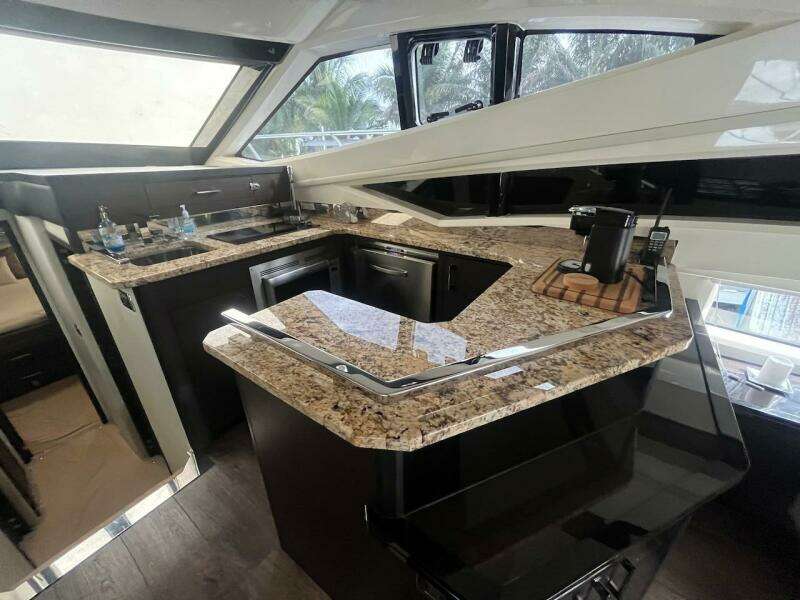 2017 Marquis 500 Sport Yacht kitchen with granite countertops and modern appliances.