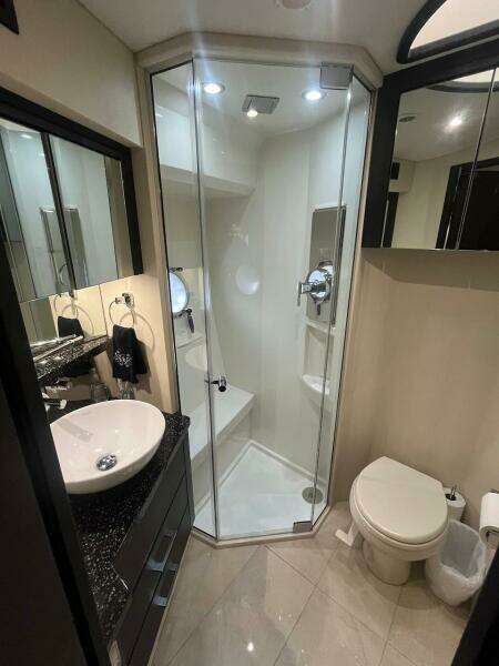 2017 Marquis 500 Sport Yacht bathroom with modern shower and sink.