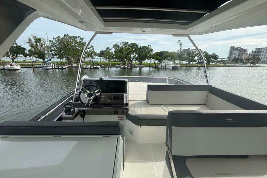Interior view of 2020 Galeon 500 Fly yacht with helm and seating area.