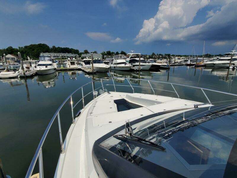 Galeon 500 Fly 2020 yacht docked at a marina with other boats.