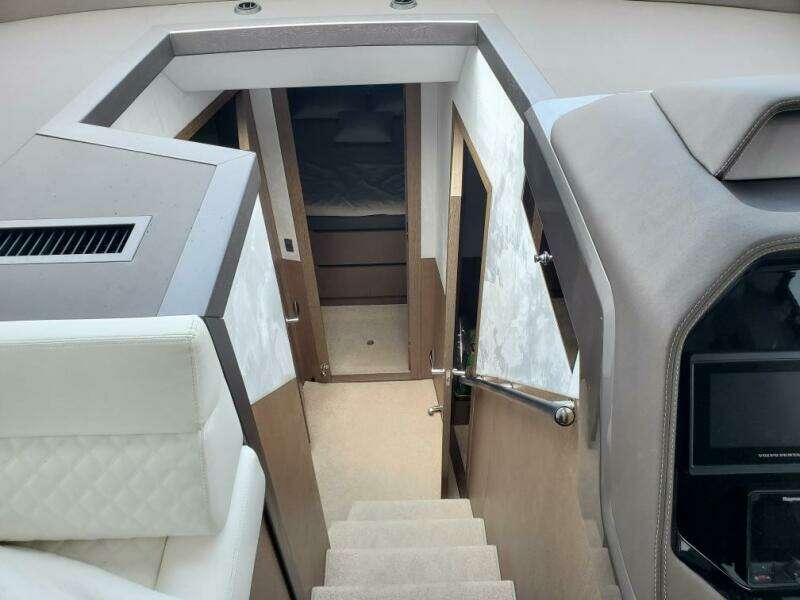 Interior cabin of 2020 Galeon 500 Fly yacht with stairs and seating.