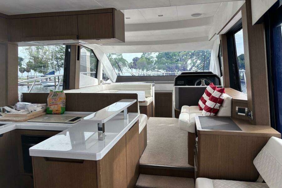 Interior of 2020 Galeon 500 Fly yacht with modern kitchen and seating area.