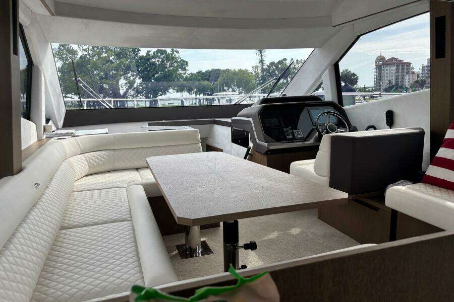 Interior of 2020 Galeon 500 Fly yacht with luxurious seating and helm.
