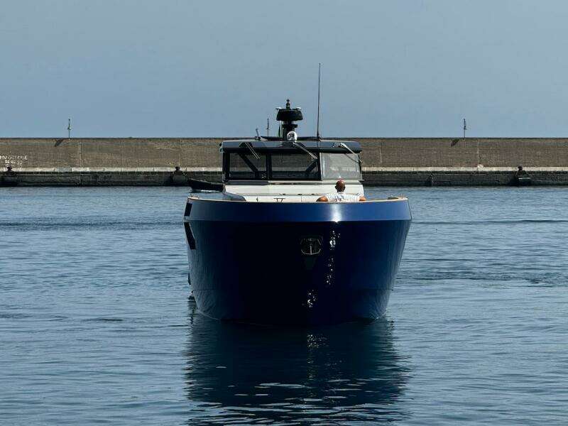 2025 Aicon Audace 50 yacht in harbor, front view, calm water.